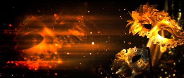 Image of Beautiful carnival masks on black background with golden glitter, bokeh effect. Banner design with space for text