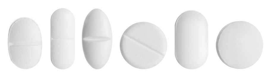 Image of Different pills in row isolated on white, set