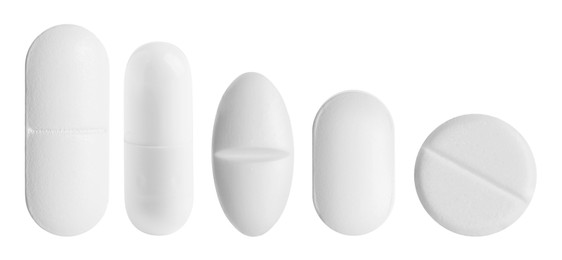 Image of Different pills in row isolated on white, set