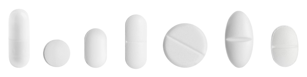 Image of Different pills in row isolated on white, set