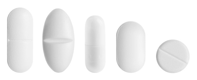 Image of Different pills in row isolated on white, set