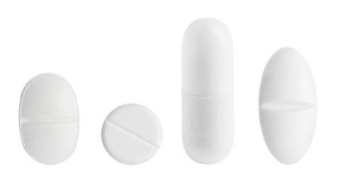 Image of Different pills in row isolated on white, set