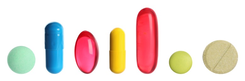 Image of Different pills in row isolated on white, set