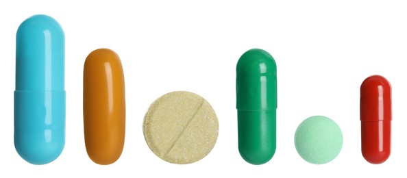 Image of Different pills in row isolated on white, set