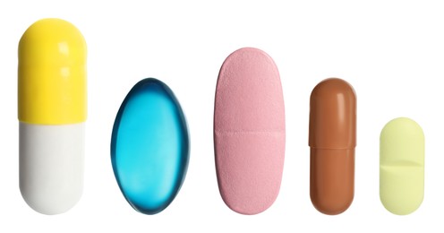 Image of Different pills in row isolated on white, set