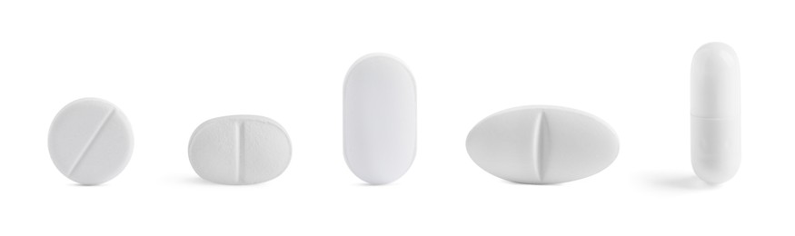 Image of Different pills in row isolated on white, set