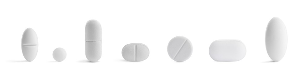 Image of Different pills in row isolated on white, set