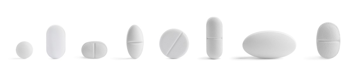 Image of Different pills in row isolated on white, set
