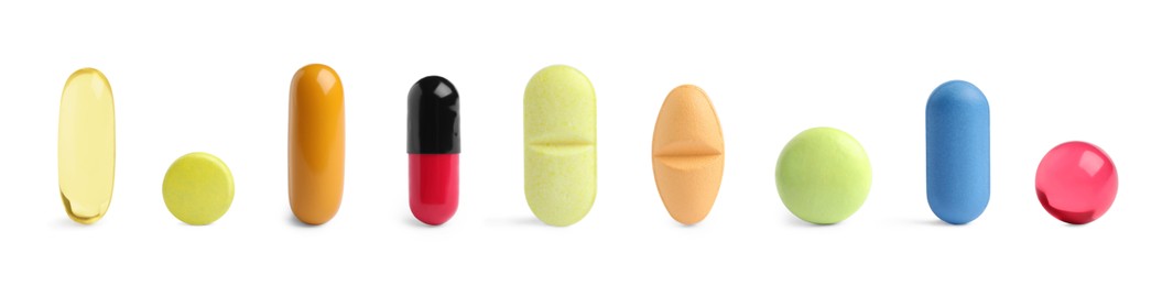 Image of Different pills in row isolated on white, set