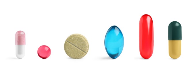 Image of Different pills in row isolated on white, set