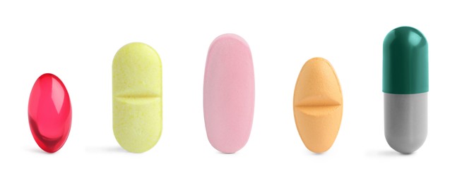 Image of Different pills in row isolated on white, set