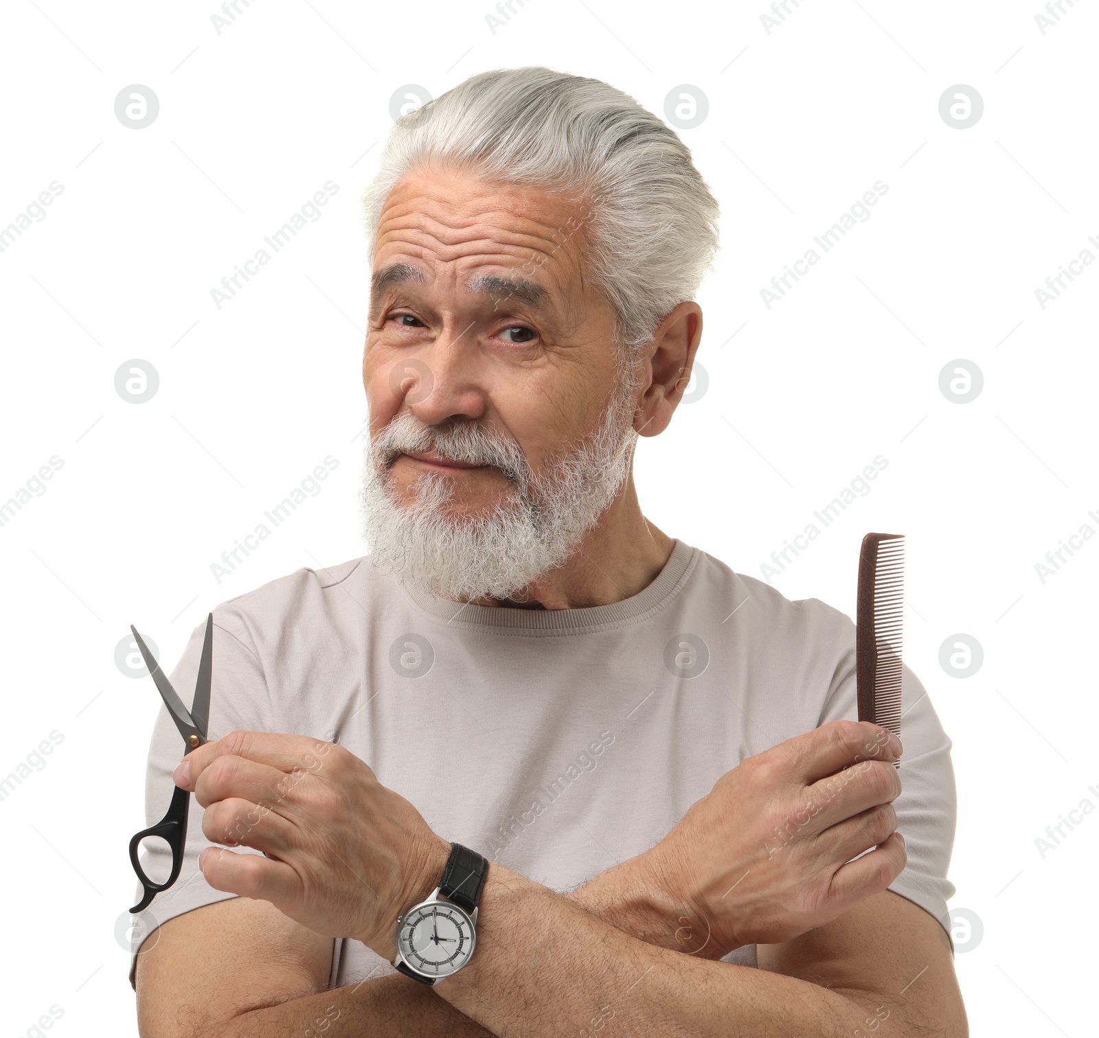 Photo of Bearded senior man holding comb and scissors on white background