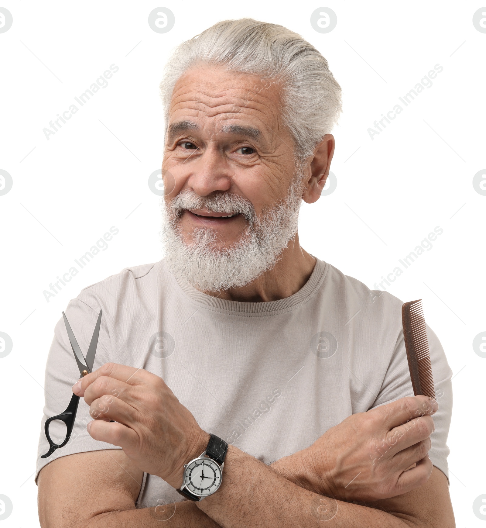 Photo of Bearded senior man holding comb and scissors on white background