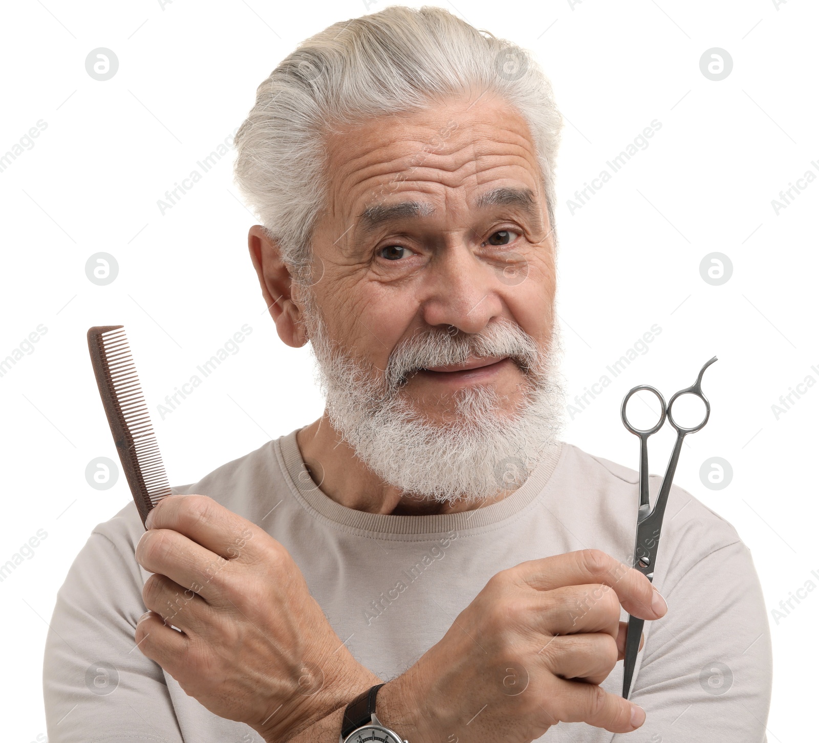 Photo of Bearded senior man holding comb and scissors on white background