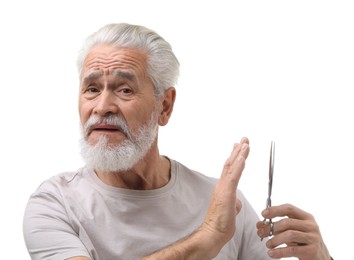 Photo of Bearded senior man with scissors making stop gesture on white background