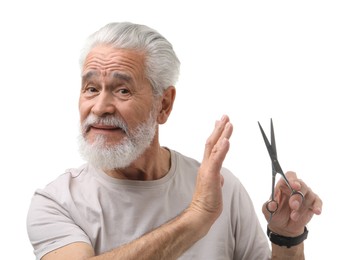 Bearded senior man with scissors making stop gesture on white background