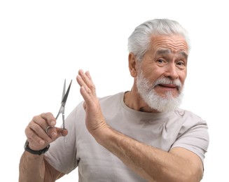 Photo of Bearded senior man with scissors making stop gesture on white background