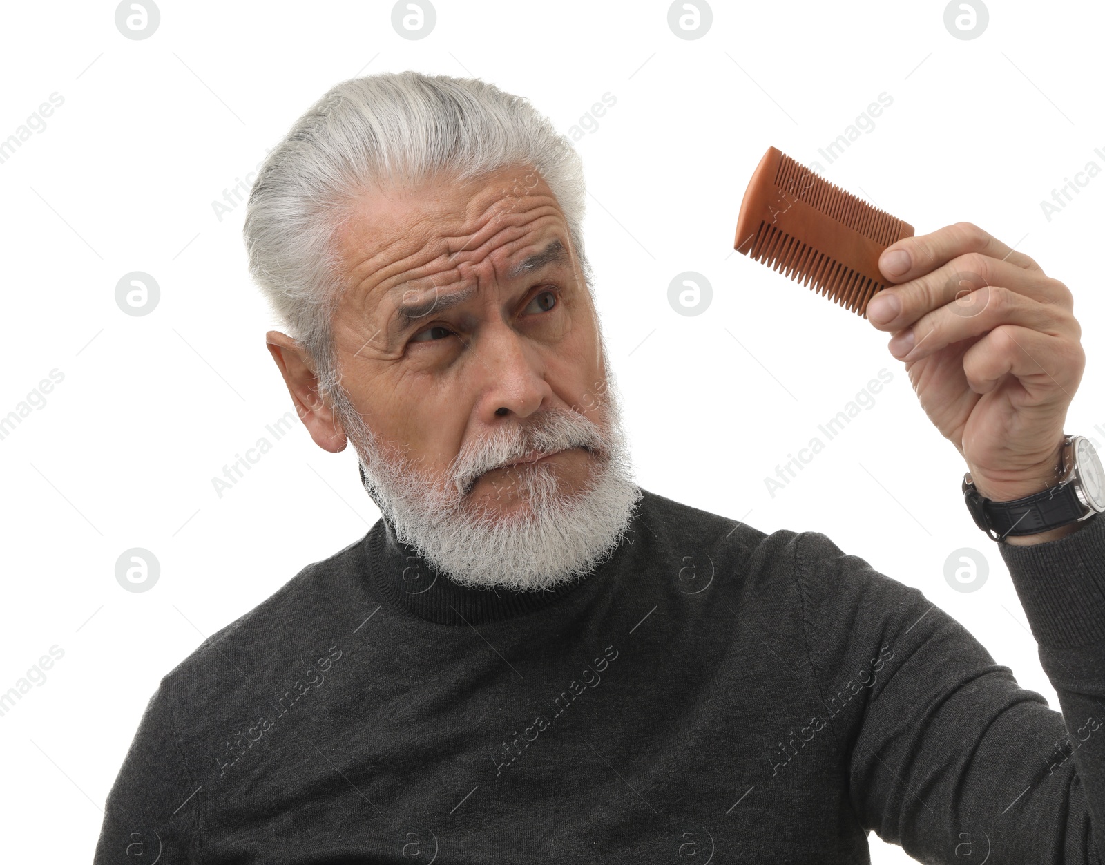 Photo of Bearded senior man holding comb on white background