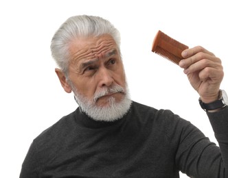 Photo of Bearded senior man holding comb on white background