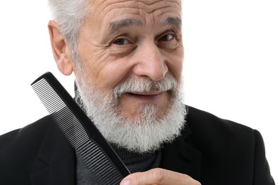 Photo of Bearded senior man with comb on white background