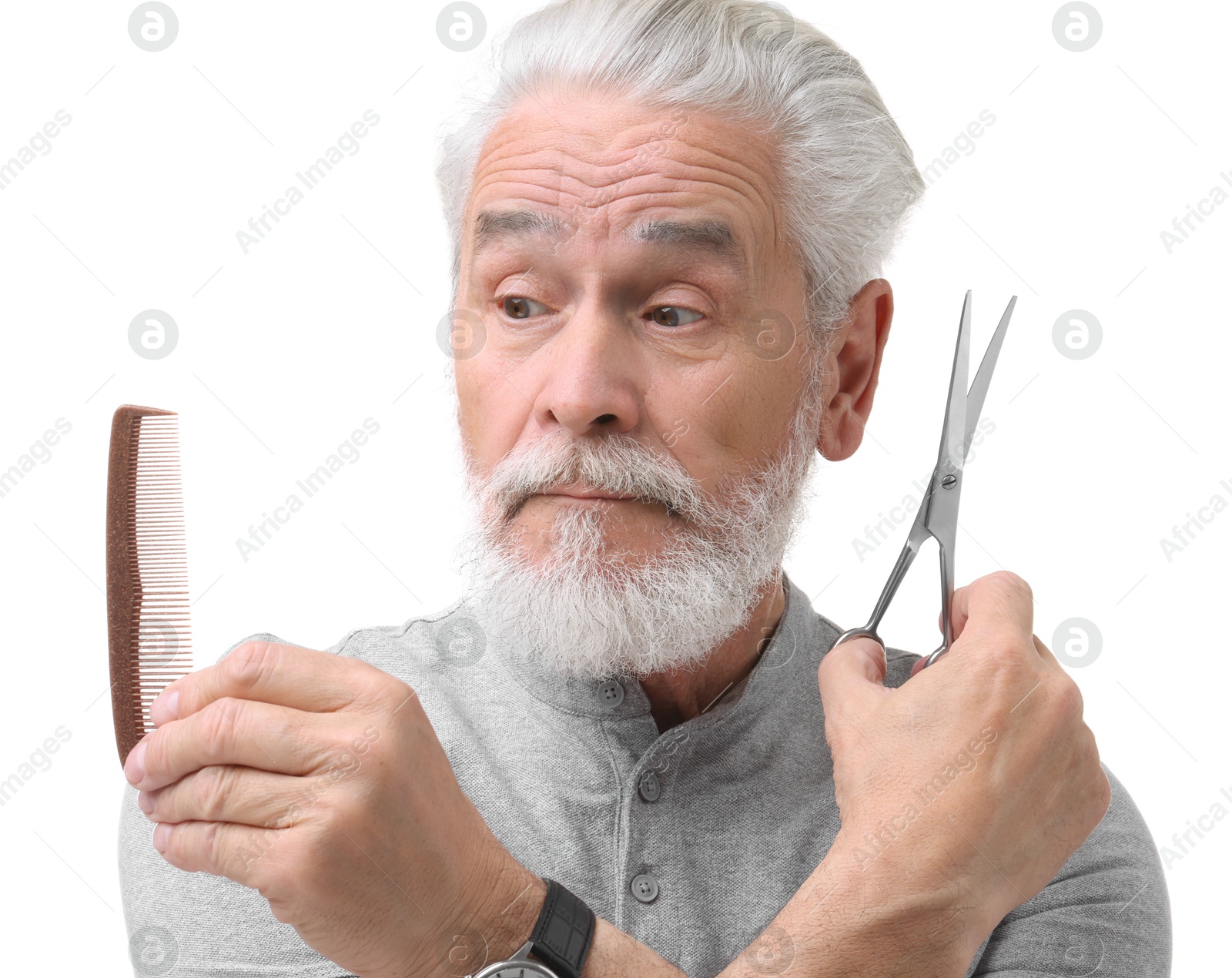 Photo of Bearded senior man with comb and scissors on white background