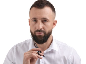 Photo of Man trimming beard with scissors on white background