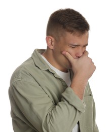 Photo of Distressed young man crying on white background