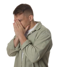 Photo of Distressed young man crying on white background