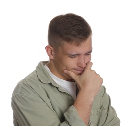 Photo of Distressed young man crying on white background