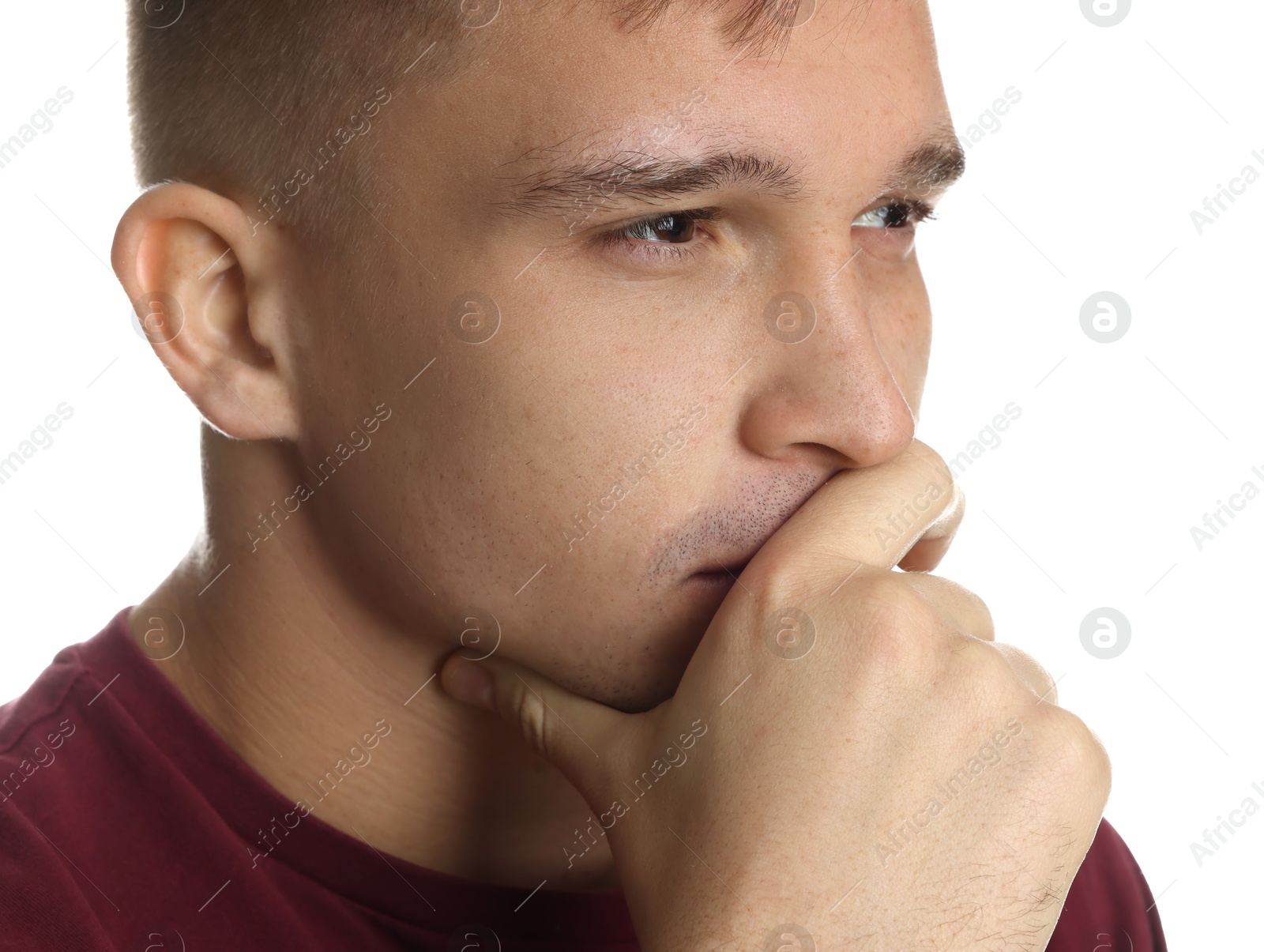 Photo of Distressed young man crying on white background