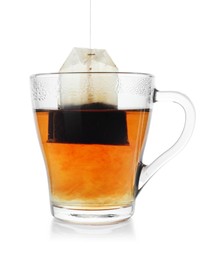 Photo of Cup with teabag isolated on white. Brewing aromatic tea