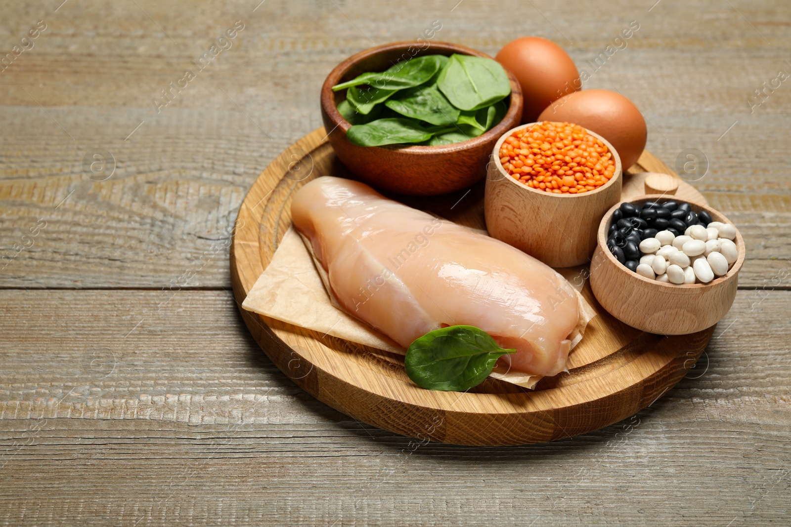 Photo of Different products rich in estrogen on wooden table