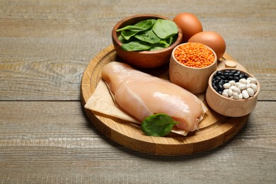 Photo of Different products rich in estrogen on wooden table