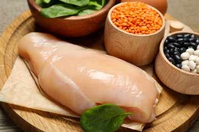 Different products rich in estrogen on wooden table, closeup