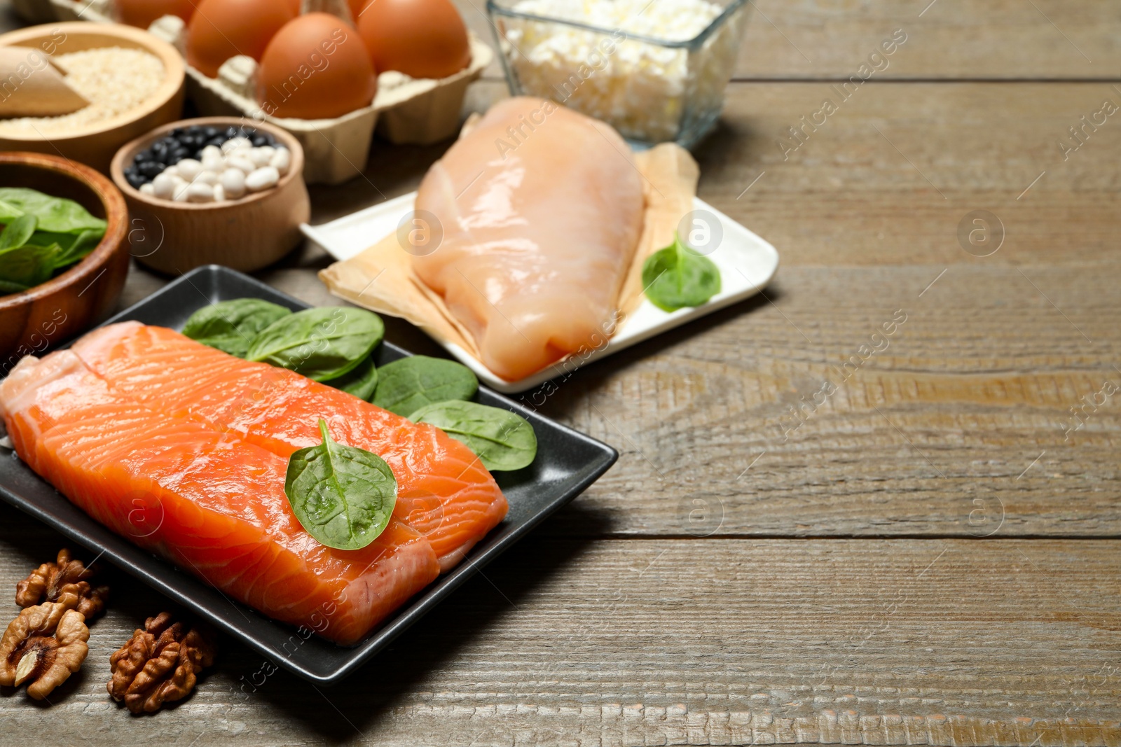 Photo of Different products rich in estrogen on wooden table