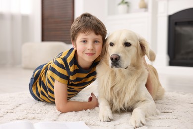 Photo of Boy with his cute dog at home