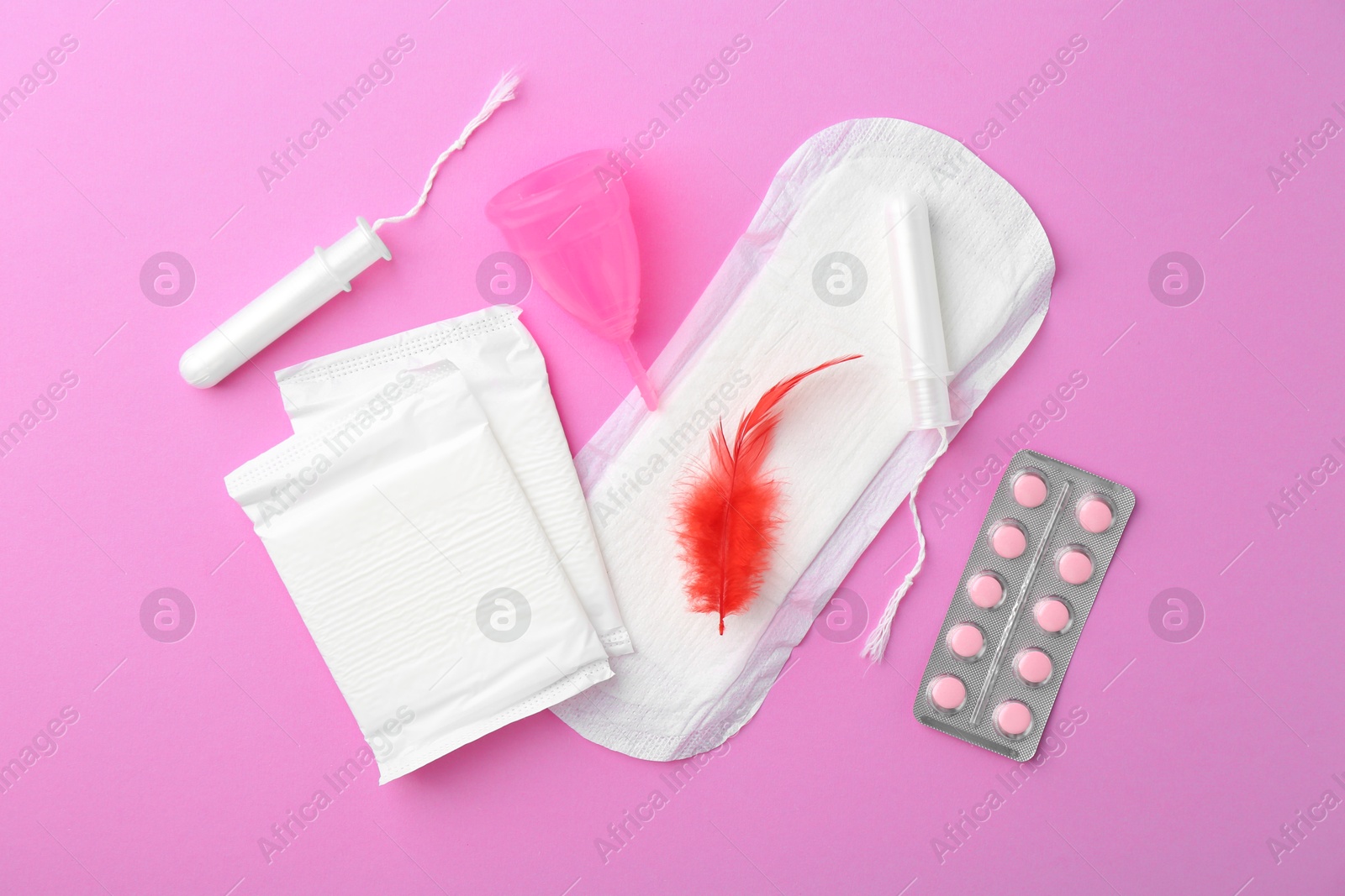 Photo of Flat lay composition with menstrual products on violet background