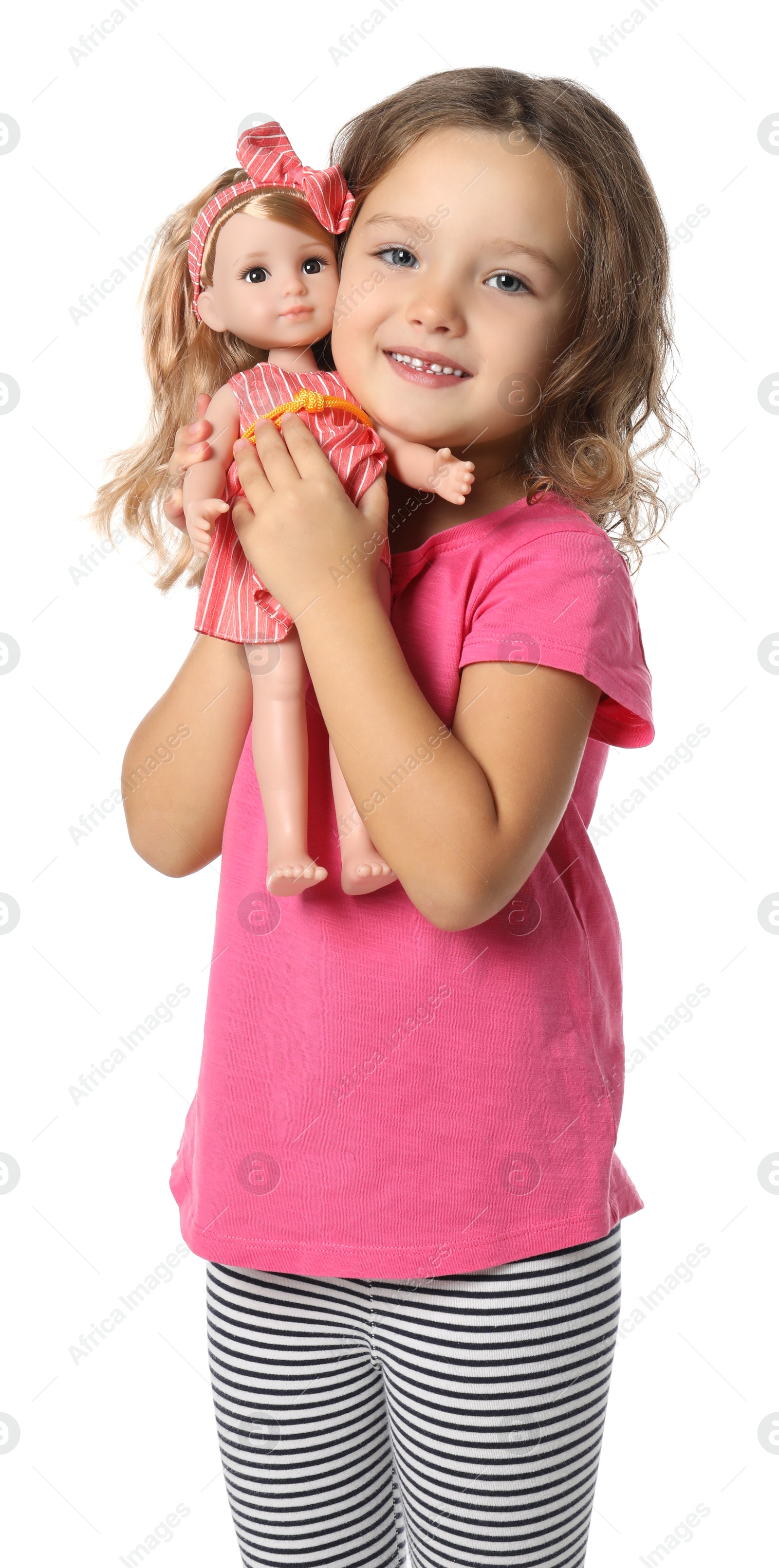 Photo of Cute little girl holding doll on white background