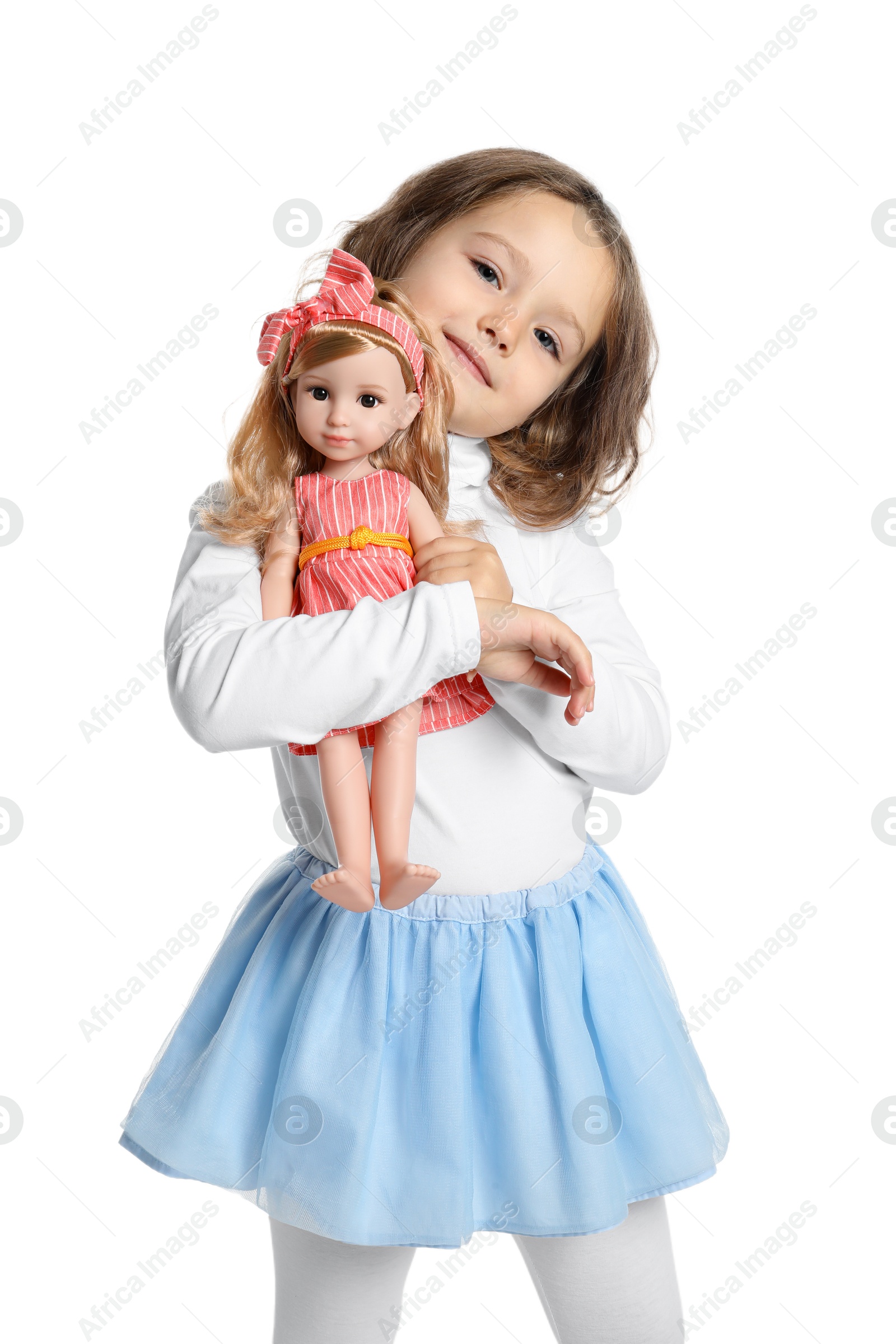 Photo of Cute little girl embracing her doll on white background