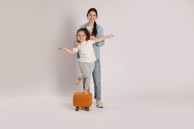 Photo of Full length portrait of cute sisters on white background