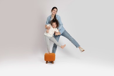 Photo of Full length portrait of cute sisters on white background