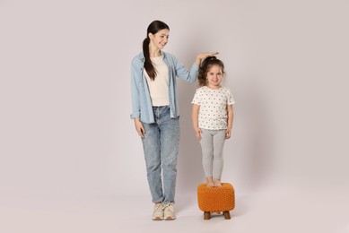 Photo of Full length portrait of cute sisters on white background