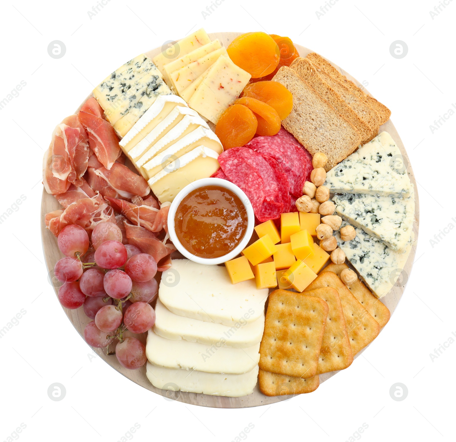 Photo of Different types of cut cheese and other snacks isolated on white, top view