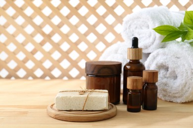 Photo of Composition with cosmetic products for spa treatment on wooden table, space for text