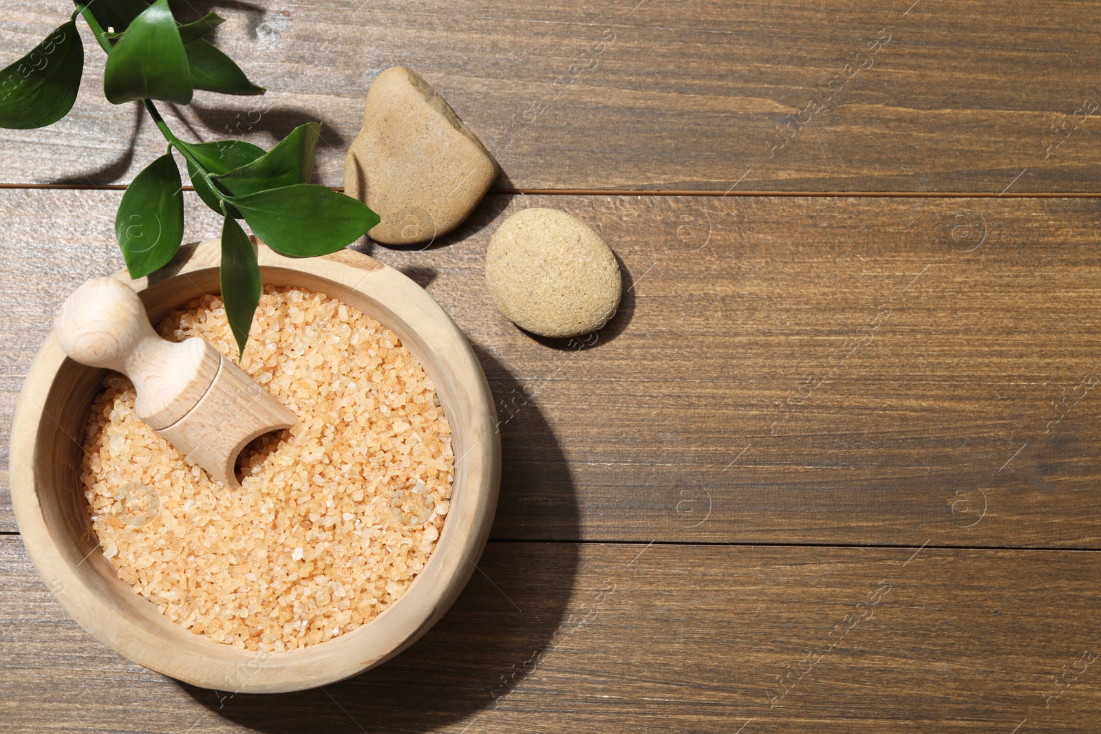 Photo of Spa composition with sea salt and leaves on wooden table, flat lay. Space for text