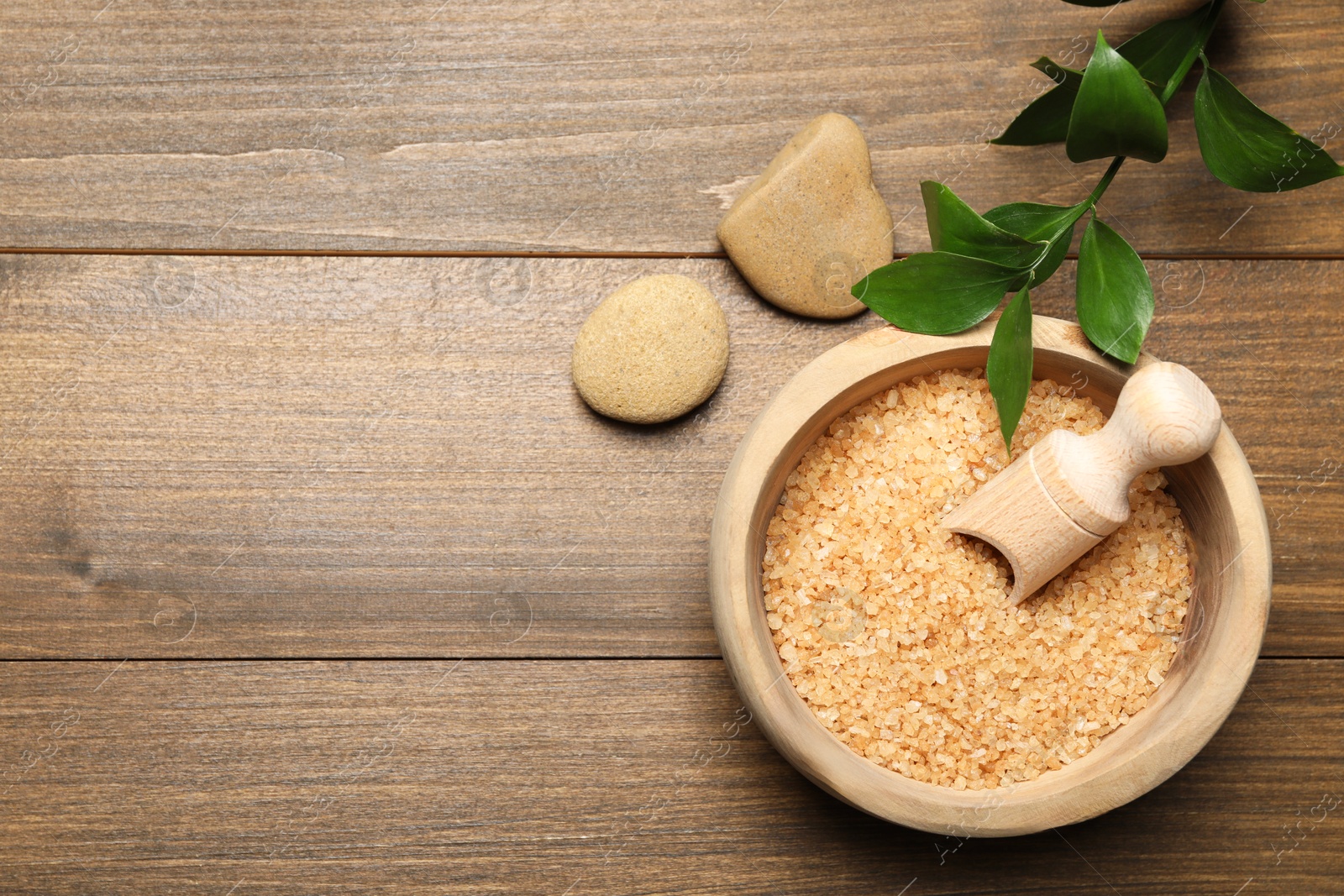 Photo of Spa composition with sea salt and leaves on wooden table, flat lay. Space for text