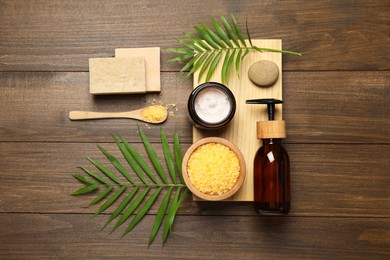 Photo of Spa composition with different cosmetic products on wooden table, flat lay