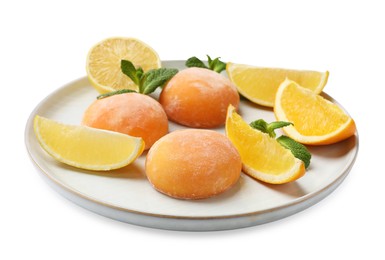 Photo of Plate with tasty mochi, cut orange, lemon and mint isolated on white