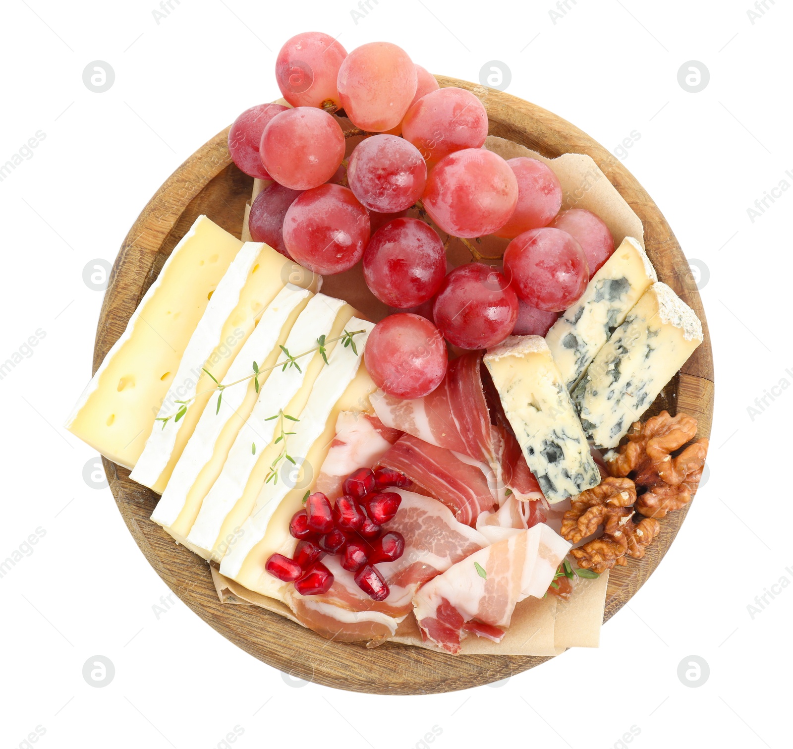 Photo of Different types of cut cheese and other snacks isolated on white, top view