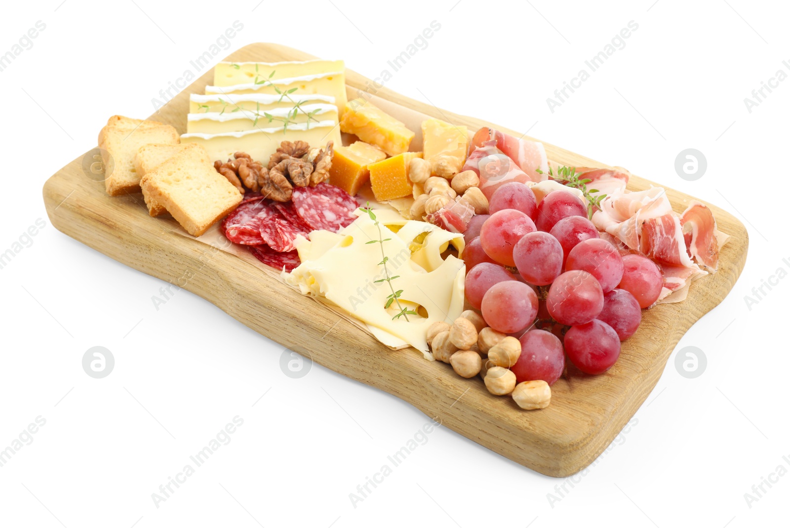 Photo of Different types of cut cheese and other snacks isolated on white